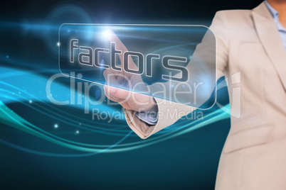Businesswoman pointing to word factors