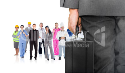 Composite image of businessman holding briefcase