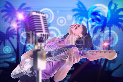 Composite image of pretty girl playing guitar