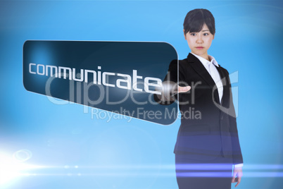 Businesswoman pointing to word communicate
