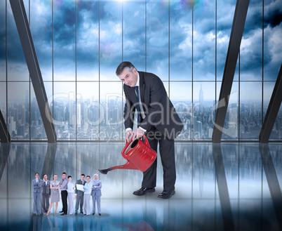 Composite image of mature businessman watering tiny business tea