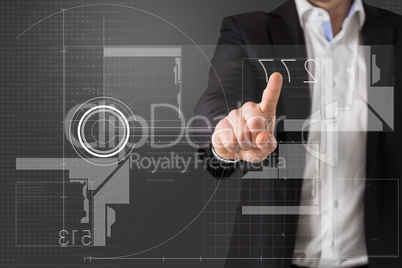 Composite image of businessman standing and pointing to interfac Composite image of businessman standing and pointing to interfac
