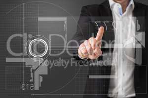 Composite image of businessman standing and pointing to interfac