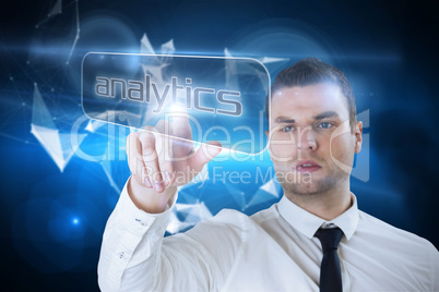 Businessman pointing to word analytics