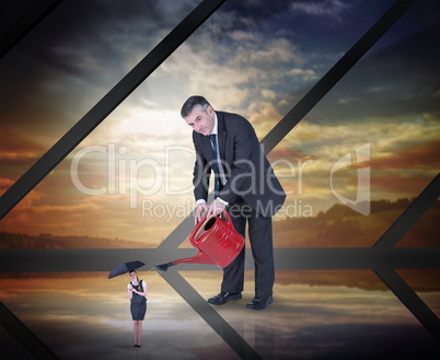 Composite image of mature businessman watering tiny businesswoma