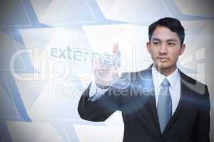 Businessman pointing to word external