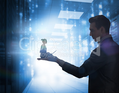 Composite image of businesswoman using laptop