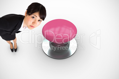 Composite image of serious businesswoman bending