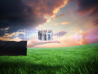 Composite image of business team looking at camera