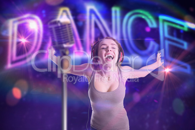 Composite image of pretty girl listening to music