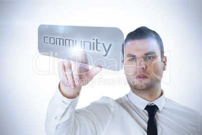 Businessman pointing to word community