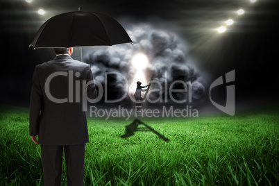 Composite image of businessman climbing up ladder