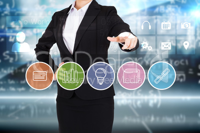 Businesswoman in suit pointing finger to business app buttons