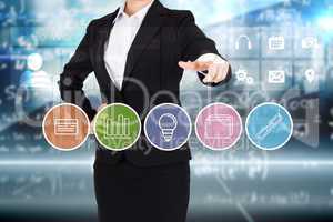 Businesswoman in suit pointing finger to business app buttons
