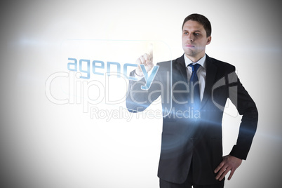 Businessman pointing to word agency