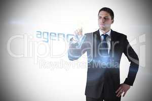 Businessman pointing to word agency
