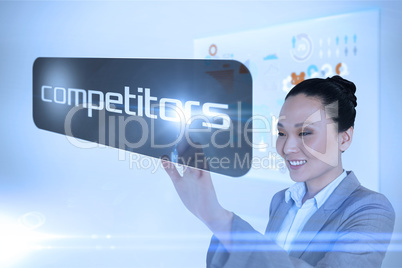 Businesswoman pointing to word competitors