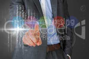 Businessman touching the words email marketing on interface