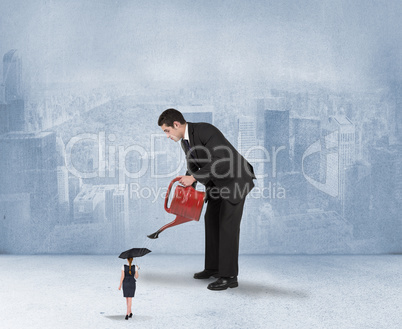 Composite image of businessman watering tiny businesswoman Composite image of businessman watering tiny businesswoman