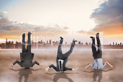 Composite image of businessmen burying their heads