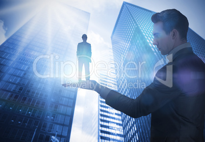 Composite image of businessman holding architect