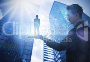 Composite image of businessman holding architect