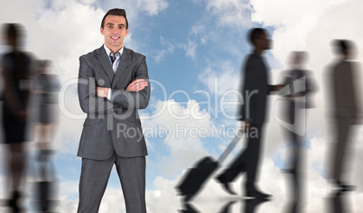Composite image of businessman in grey suit smiling at camera Composite image of businessman in grey suit smiling at camera