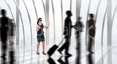 Composite image of redhead businesswoman in a blindfold