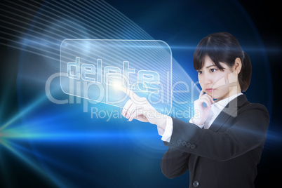 Businesswoman pointing to word delete