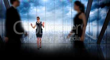 Composite image of business people walking in a blur