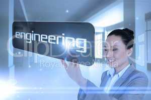Businesswoman pointing to word engineering