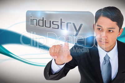 Businessman pointing to word industry