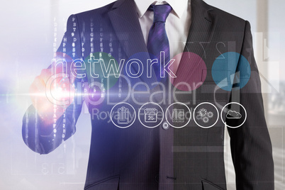 Businessman touching the word network on interface