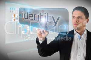 Businessman pointing to word identity
