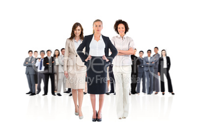 Composite image of team of businesswomen looking at camera