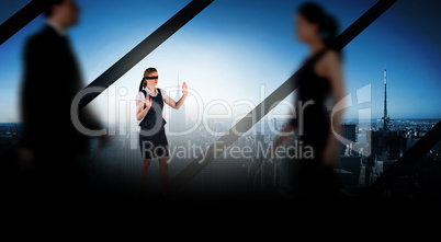 Composite image of business people walking in a blur