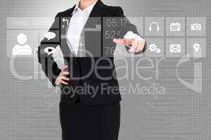 Businesswoman in suit pointing finger to app menu