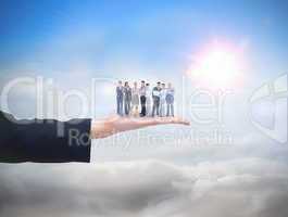 Composite image of business team looking at camera