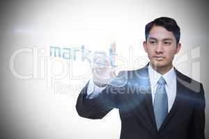 Businessman pointing to word market