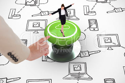 Composite image of businesswoman performing a balancing act