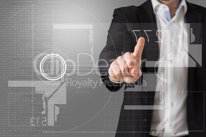 Composite image of businessman standing and pointing at interfac