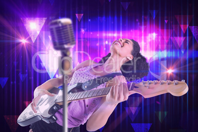 Composite image of pretty girl playing guitar