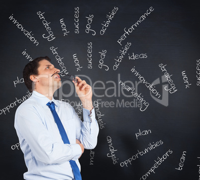 Composite image of thinking businessman biting glasses