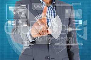 Composite image of focused businessman pointing to interface