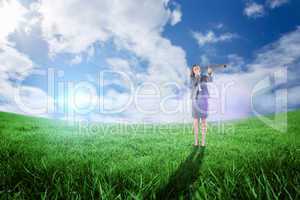 Composite image of businesswoman looking through a telescope