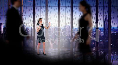 Composite image of business people walking in a blur