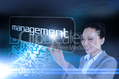 Businesswoman pointing to word management