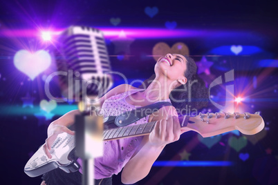 Composite image of pretty girl playing guitar