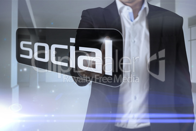 Businessman pointing to word social