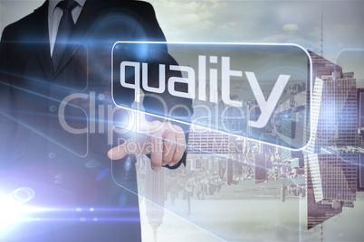 Businessman presenting the word quality